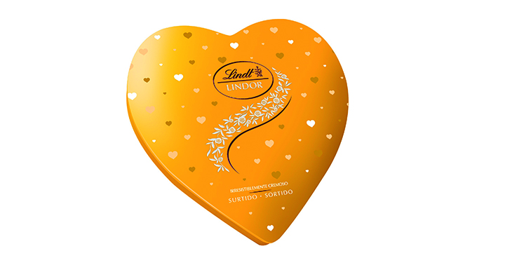 Bombones en lata dorada de corazón para celebrar San Valentín